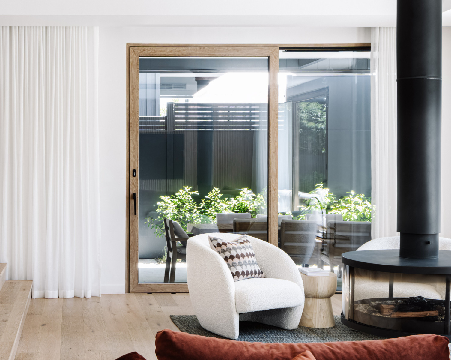 PVC sliding windows and doors with wood-effect finish, installed in a modern home